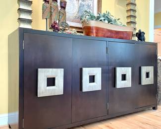 $600; 80 x 20 x 40; modern buffet with four doors and lots of storage; no name can be found but amazing silver painted wood square pulls; minor scrath on top