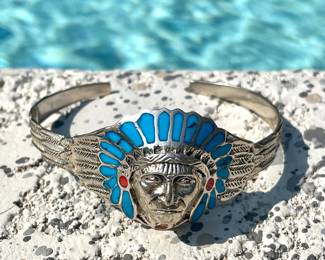 $40; silver cuff bracelet with turquoise chief head
