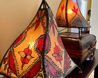$32; 9 x 9 x 14; leather, hand-sewn and hand-painted teepee lamp;                                                                                                             $28; 8 x 8 x 14; leather, hand-sewn and hand-painted teepee lamp;                                                                                                      $18; wicker suitcase box
