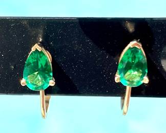 $70; 14K clips with green stones
