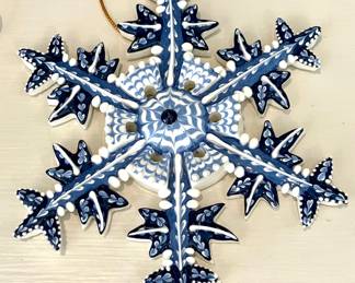 $28 each (4 available, 1 additional broken for $10); 6"d; Irma Starr ceramic hand made snowflakes made in Sri Lanka