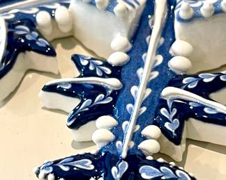 $28 each (4 available, 1 additional broken for $10); 6"d; Irma Starr ceramic hand made snowflakes made in Sri Lanka; close up view