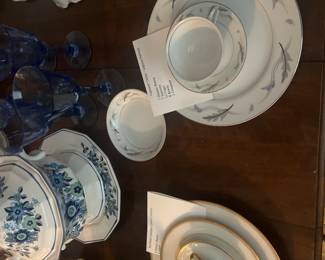 Lots of China Settings displayed.  The remaining pieces are boxed 