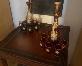 Leather top antique table on casters 