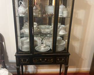 Asian inspired black hand painted curio with doors shelves and drawers 