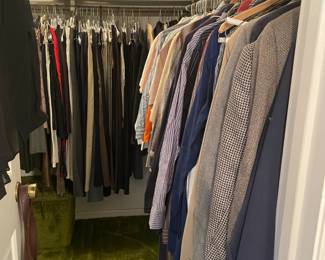 closet full of men's and women's designer vintage clothing and shoes. Some labels are well known designers