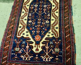 Hand woven Persian rug in navy colors.
