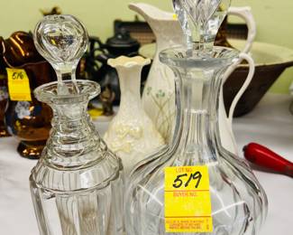 Several Edwardian cut crystal decanters.