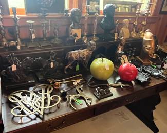 Brass candle holders,  cast trivets, metal and stone busts