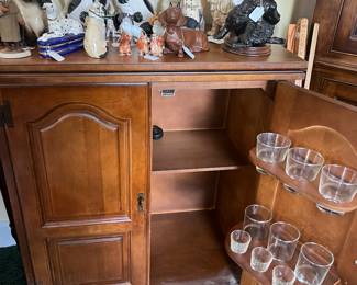 Staffordshire dog figures  Bar cabinet with glassware