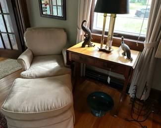 Chair and ottoman, table, lamp, and brass birds