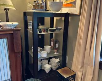 Modern bookshelf, lotus flower soup serving set, and assorted pottery pieces