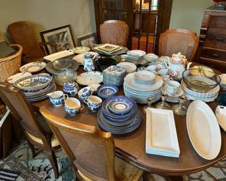 Several different different dinnerware, serving platters, teapots, candlesticks