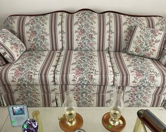 Couch with wood trim. 