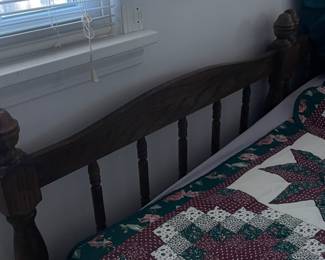 Two wood twin beds with frames, box springs and mattresses. 