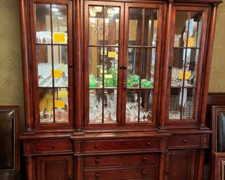 Wonderful matching lighted china cabinet- filled with Waterford crystal.