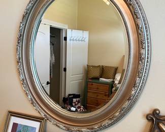 Elegant, beveled glass oval mirror