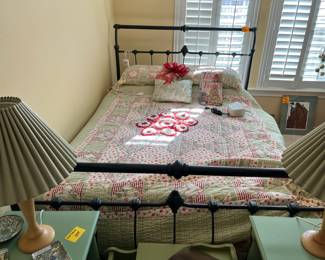 Quaint queen size iron bed w/ comforter