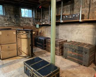 Antique trunks in various shapes, colors, and sizes