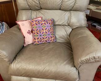 Leather recliner and throw pillows, floor lamp