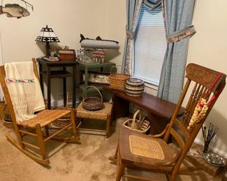 woven wood rocking chairs, table lamps, antiques, woven baskets, fish decor, paintbrushes and mixing palette