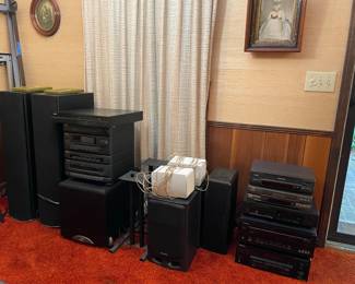 various electronics, speakers, stands, audio equipment