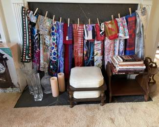 silk linens, fine glass vases, white leather and wood ottoman and floor cushions, antique wood corner curios shelf,, antique wood stand