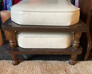 white leather and wood ottoman and floor cushions