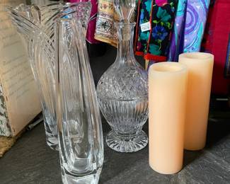 pillar candles, fine glass vases and decanter, silk linens