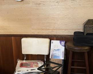 decorative plates, antique scale, vintage christmas tree stand, vintage white leather chairs