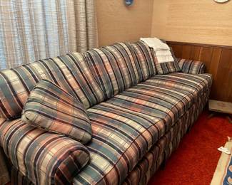 blue, white, pink, black plaid sofa