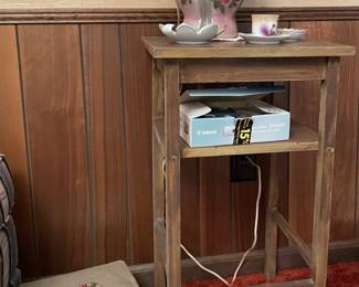 antique embroidered foot rest, vintage pink ceramic lamp, canon digital point and shoot camera