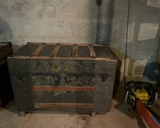 Antique trunks in various shapes, colors, and sizes