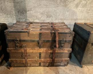 Antique trunks in various shapes, colors, and sizes