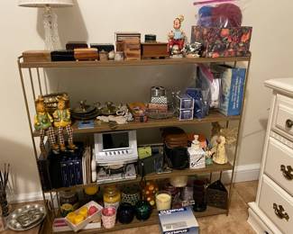 vintage brass shelves, antique boxes, vintage toys, candles