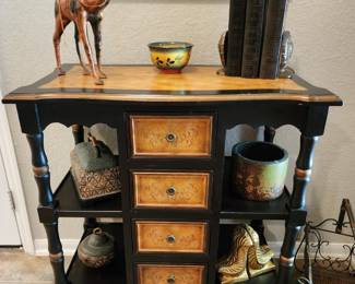 It's hard to pick a favorite.piece at this sale! So many cool pieces. Entry piece in ebony wood amd cool decor.