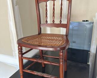 Wooden chair with cane seat