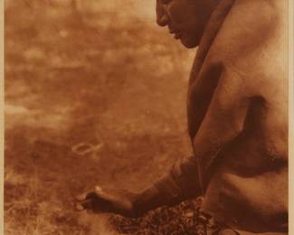 2110
Edward S. Curtis
1868-1952
"Kindling Fire - Assiniboin," Plate 631 From "The North American Indian" Volume 18
Photogravure in brown on tissue-thin Japanese paper
From the Suffolk Engraving Co., Cambridge, MA edition printed after the 1926 original photograph copyrighted by Curtis; with the title, plate number, copyright, publisher, and artist name all printed in the blank outside the image
Image: 15.625" H x 11.625" W; Sheet: 17.5" H x 12.875" W
Estimate: $200 - $400