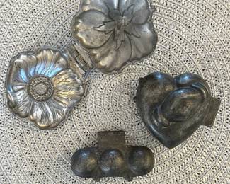 Antique pewter ice cream molds.
Upper Left: Flower (rare). $50
Bottom Center: 3 Balls. $40
Upper Right: Heart with joined hands. $60