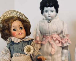Left: Shirley Temple. $35
Right: Low brow china doll: $65