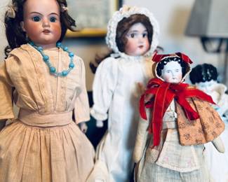 Left: Armand Marseille AM-370. Estate sale price: $100
Middle: Armand Marseille Floridora. Estate sale price: $75
Right: Flat top china doll with hood: $50