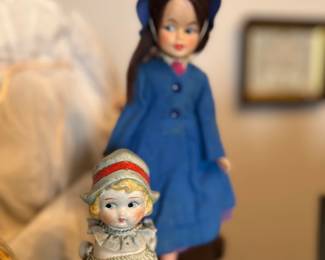 Left doll: $15. 
Right doll: $10