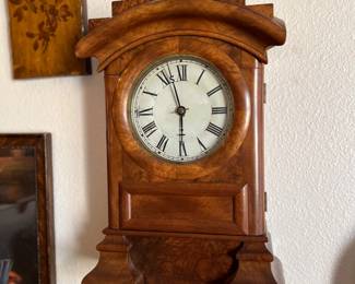 Antique Seth Thomas arch top burl mahogany mantle clock. Estate sale price: $300