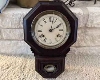 Antique dark wood wall clock. Estate sale price: $150