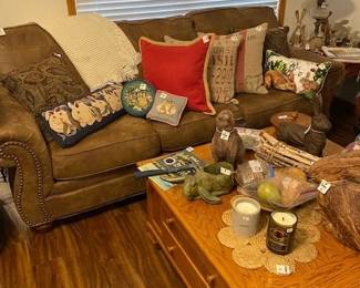 microfiber couch, pillows, coffee table with drawers and side  holders, lots of bunny decor