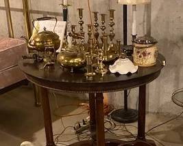 brass candlesticks, teapots, antique table