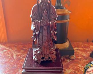 Carved Asian figure.