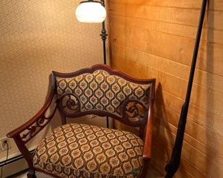 Parlor seat, bridge lamp and long rifle vignette.