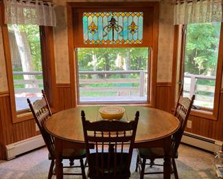 Antique oval table, pressed back chairs 
