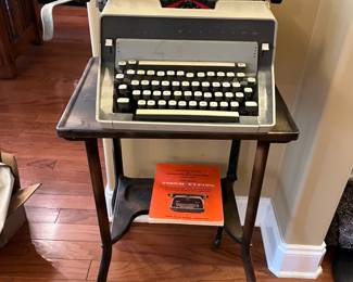 #8	Metal Typewriter Table w/typewriter on Wheels - 16x14x27	 $30.00 			
